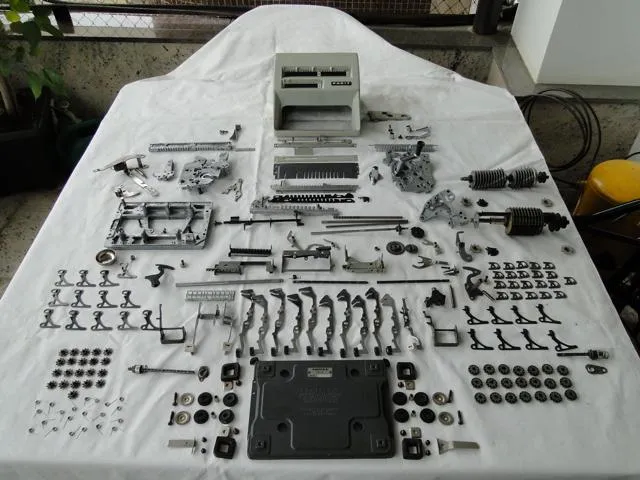 The calculator fully disassembled into more than 500 parts